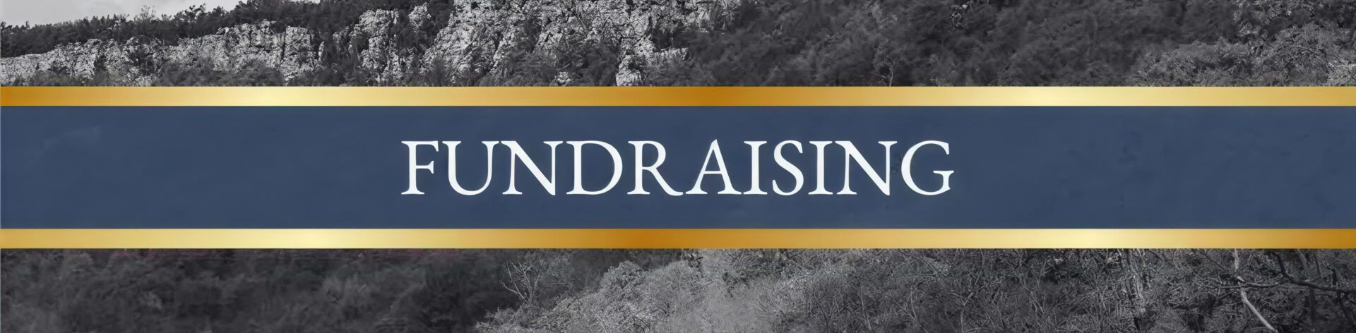 Mountain scenery behind fundraising sign